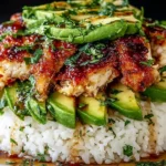 Honey Lime Chicken and Avocado Rice Stack with crispy glazed chicken, creamy avocado slices, and herb-seasoned white rice