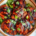 Grilled Chicken Asado topped with fresh cilantro in a rustic bowl