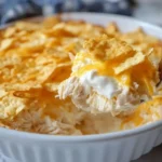 Dolly Parton’s 5-Ingredient Country-Style Casserole with shredded chicken, sour cream, melted cheddar, and buttery cracker topping.