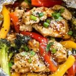 Teriyaki Chicken Foil Packet Dinner with broccoli, bell peppers, and sesame seeds
