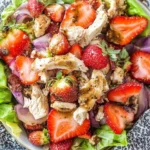Balsamic Strawberry Chicken Salad with fresh strawberries, grilled chicken, and balsamic glaze on a bed of lettuce