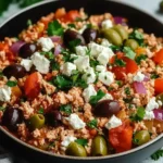 Mediterranean Keto Ground Chicken Skillet with Olives and Feta served in a black bowl and topped with parsley