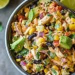 Bowl of Southwestern Chopped Chicken Salad with corn, black beans, avocado, and creamy dressing.