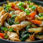 Chinese chicken and cabbage stir fry with colorful vegetables in a savory sauce