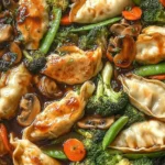 Colorful potsticker stir fry with broccoli, mushrooms, carrots, and snap peas in a savory soy-ginger sauce.