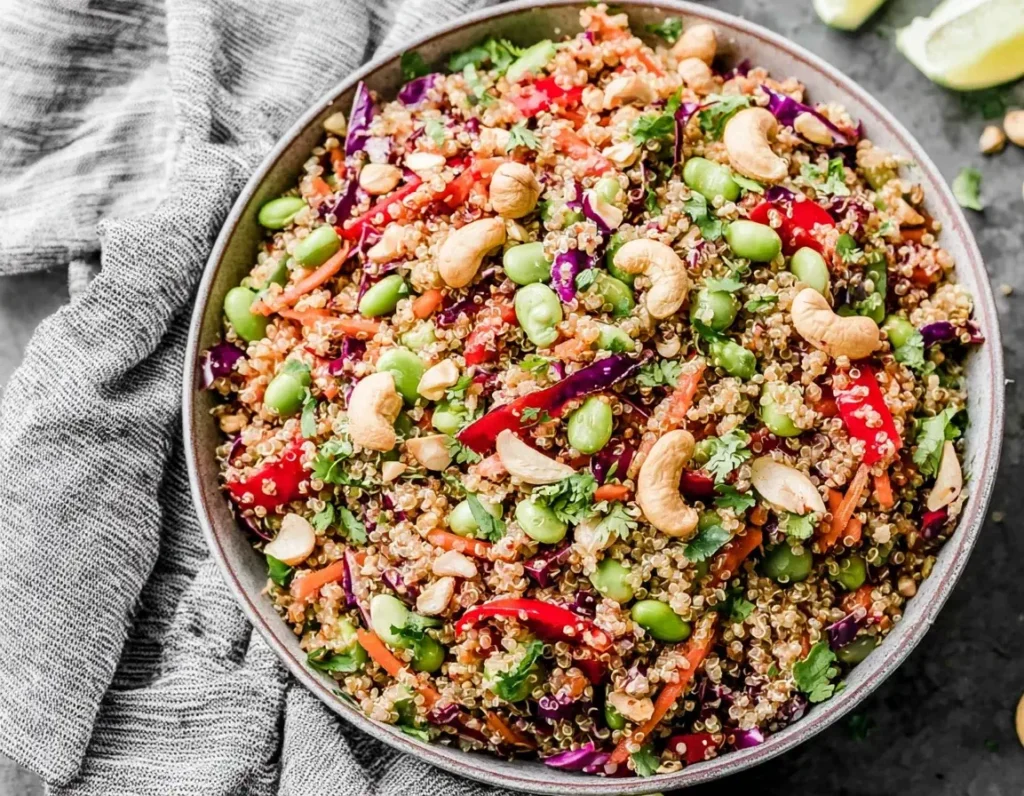 Colorful Thai Quinoa Salad with edamame, cashews, and veggies in a bowl