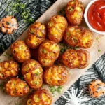 Crispy Halloween Skull Potatoes served with ketchup on a wooden board, perfect spooky snack for Halloween parties