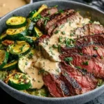 Grilled Steak Bowl with Sauce and Zucchini served with grilled zucchini, creamy herb sauce, and sliced steak over rice
