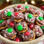Bowl of Rolo Pretzels with M&M Candies topped with Christmas sprinkles.
