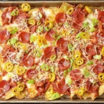 Old Chicago’s Italian Nachos Copycat topped with pepperoni, sausage, jalapeños, and melted cheese on crispy tortilla chips.