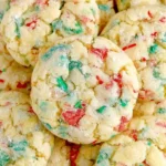 Soft and chewy Christmas Gooey Butter Cookies with festive red and green sprinkles, dusted in powdered sugar for the perfect holiday treat.