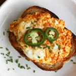 Crispy Egg Salad served on toasted bread with melted cheese, jalapeño slices, chives, and golden pan-fried edges for a bold brunch bite