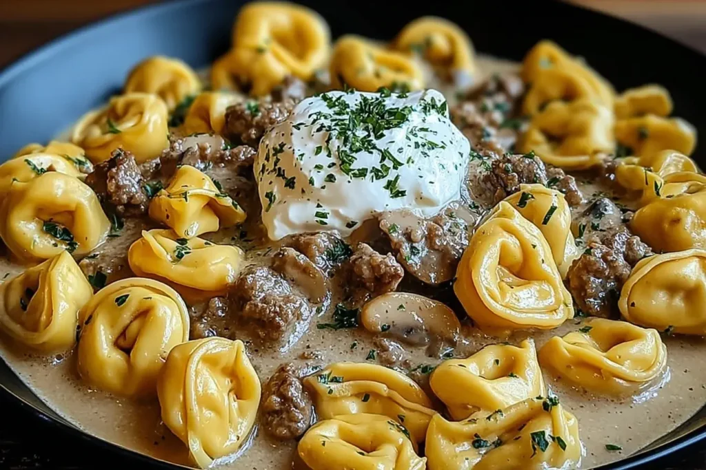 Skillet Beef Stroganoff Tortellini in creamy sauce with cheese tortellini, savory ground beef, tender mushrooms, and a dollop of sour cream.