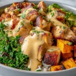 Healthy Chicken and Sweet Potato Bowls with golden pan-seared chicken, roasted sweet potatoes, fluffy rice, sautéed greens, and creamy yogurt sauce