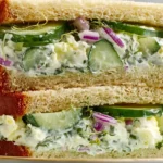 Cucumber Salad Sandwiches stacked on toasted bread with creamy Greek yogurt cucumber salad, fresh dill, red onion, and crisp cucumber slices.