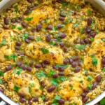 Salsa Verde Chicken Rice and Beans in a skillet with tender chicken, black beans, fluffy rice, and fresh cilantro.