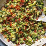 Pan-Fried Garlic Bacon Broccoli in a skillet with crispy bacon, sautéed broccoli, onions, and garlic butter.