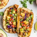 Pineapple Turkey Tacos in toasted shells with seasoned ground turkey, juicy pineapple, red cabbage, cilantro, and lime.