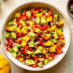 Avocado Strawberry Mango Salsa in a bowl with fresh lime, cilantro, and diced fruit—easy sweet-and-spicy summer dip.