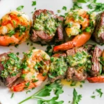 Grilled Steak & Shrimp Kabobs on skewers with garlicky herb butter and fresh parsley, grilled to juicy perfection.