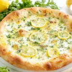 Lemon Pizza with creamy mozzarella, fresh lemon slices, and parsley on a golden baked crust—bright white pizza perfect for summer.