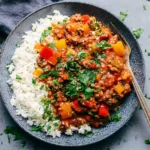 Unstuffed Peppers served over fluffy white rice, topped with fresh parsley, with colorful bell peppers and seasoned ground turkey in a rich tomato sauce.