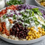 BBQ Ranch Chicken Quinoa Bowls loaded with quinoa, BBQ chicken, black beans, corn, avocado, red cabbage, tomatoes, jalapeños, and creamy ranch dressing