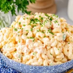 Creamy Macaroni Hawaiian Salad with elbow pasta, carrots, celery, and green onions in a rich dressing
