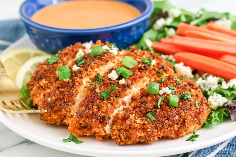 Crispy Buffalo Chicken baked until golden and crunchy, topped with green onions and blue cheese crumbles, served with buffalo ranch dipping sauce and fresh vegetables.