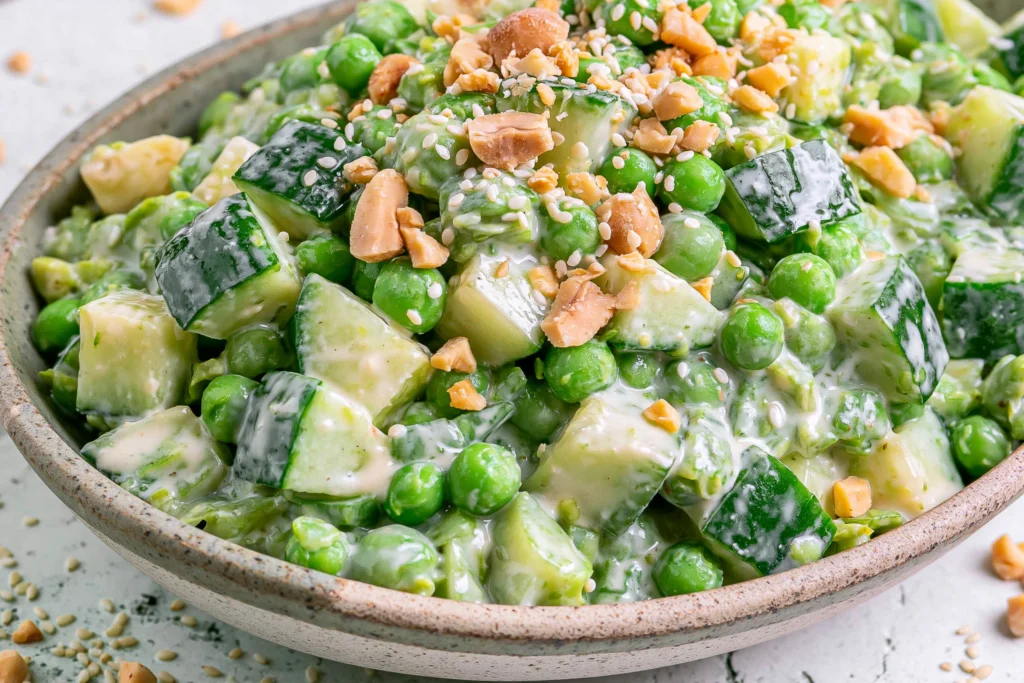 Cucumber Edamame Salad with Creamy Miso Dressing served in a bowl with fresh cucumber chunks, edamame, avocado, sesame seeds, and crunchy cashews, tossed in a creamy homemade miso dressing.