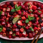 Watermelon Fruit Salad with strawberries, raspberries, blackberries, and fresh mint tossed in a zesty lime mint dressing for a refreshing summer recipe.