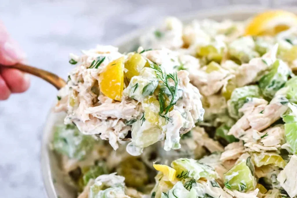 Spoonful of Pepperoncini Chicken Salad with shredded chicken, celery, dill, and pepperoncini peppers—creamy, tangy, and perfect for easy lunches.