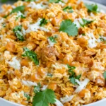 Fritos Corn Salad made with sweet corn, Chili Cheese Fritos, shredded Mexican cheese, creamy mayo, and fresh cilantro in a serving bowl.